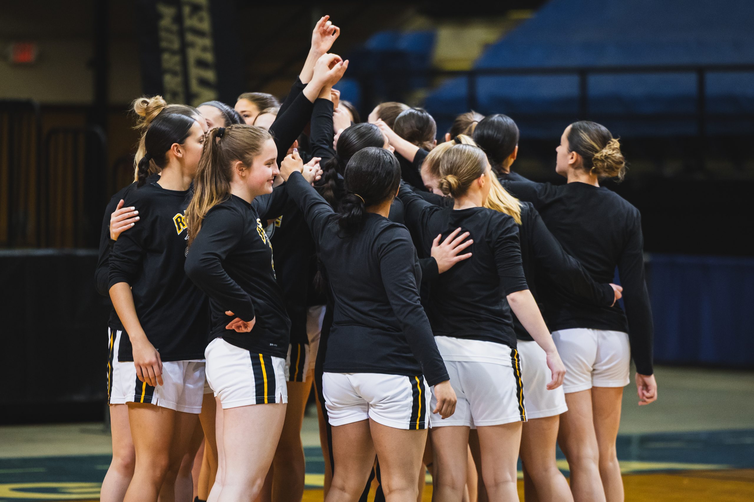 The basketball team huddles