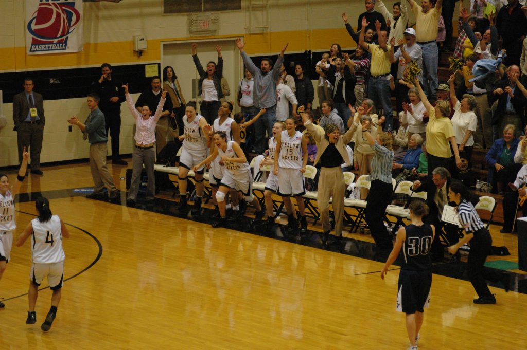 Sideline celebration at a NCAA game